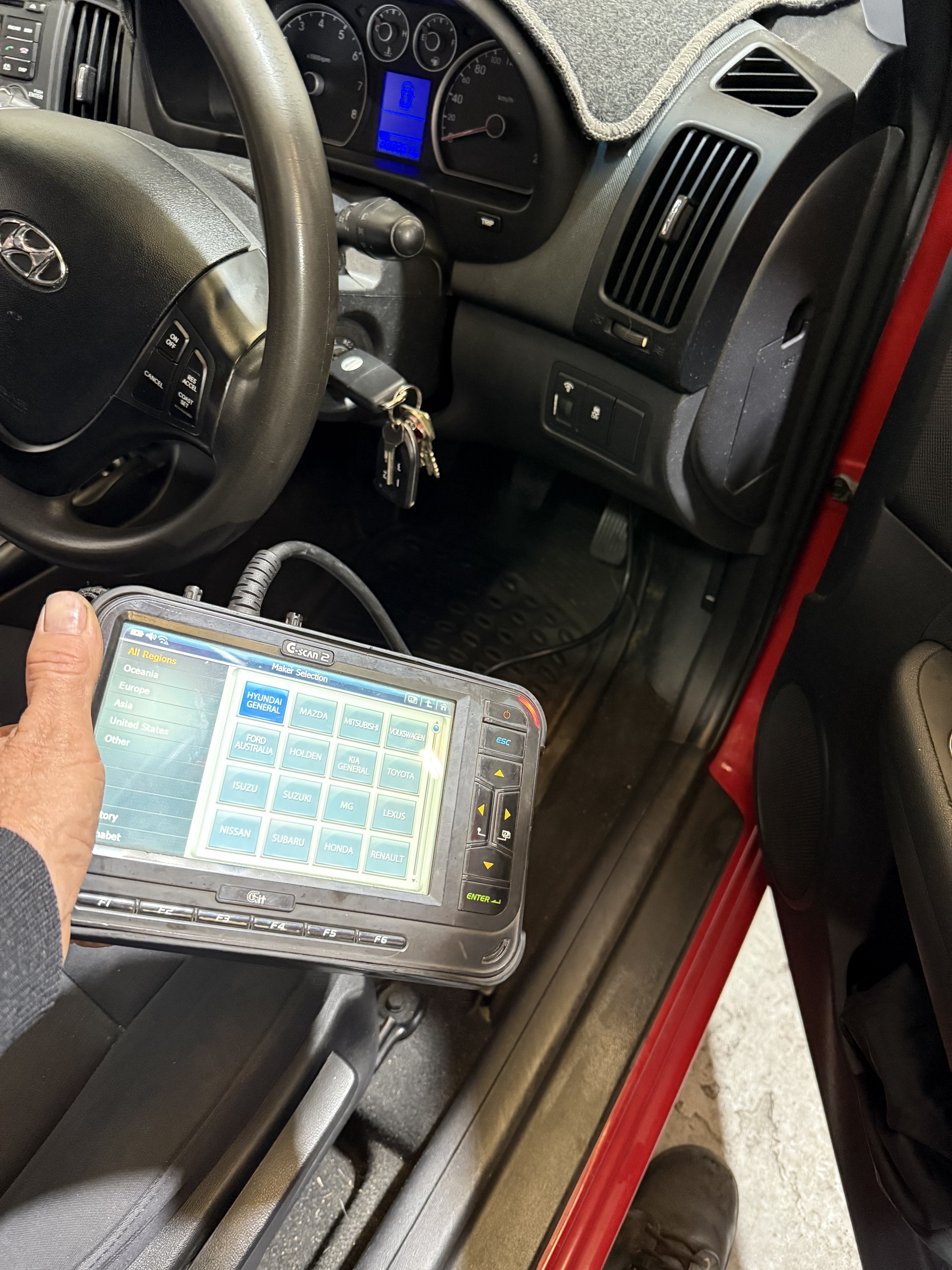 CMM Automotive technician performing a mobile pre purchase vehicle inspection in Perth